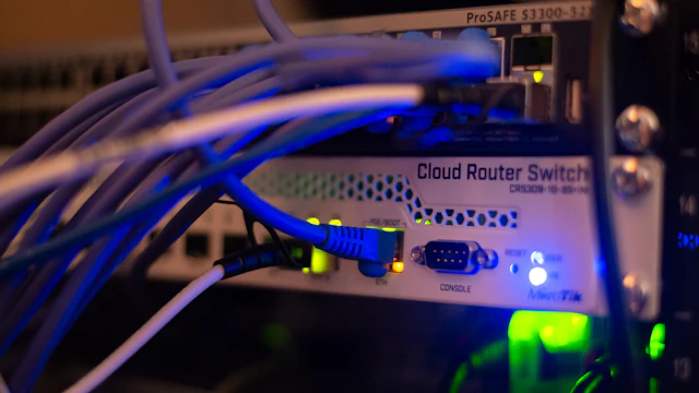 Network switch with blue cables in a server rack
